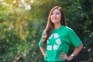 A beautiful millennial woman environmental activists standing in the park