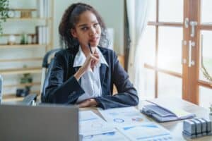 African Americans women entrepreneurs working at office thinking about span of control